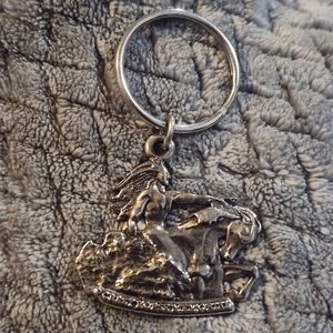 Vintage Silver-toned metal Ketchain representing the Crazy Horse Memorial.